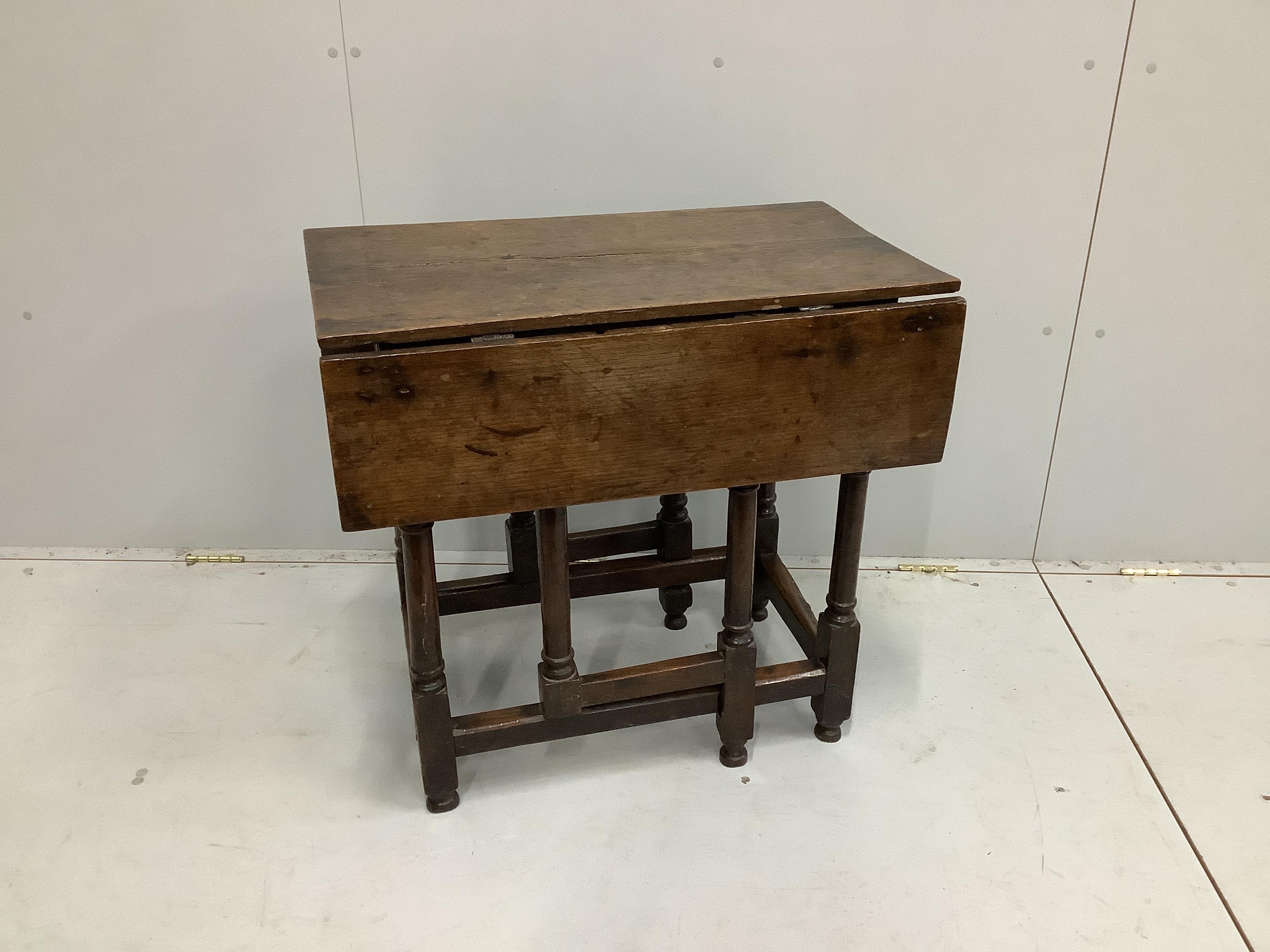 An 18th century oak drop flap table, width 46cm, depth 76cm, height 72cm